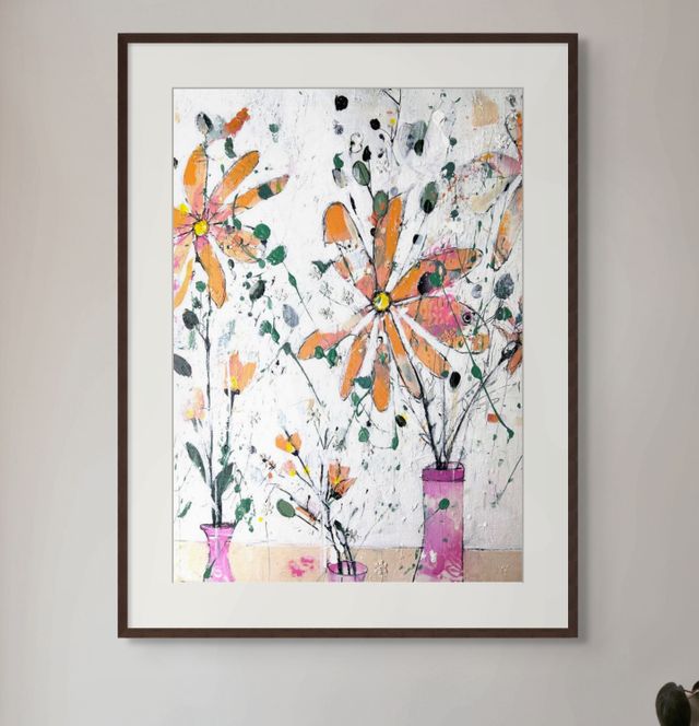 Orange flowers in pink vase